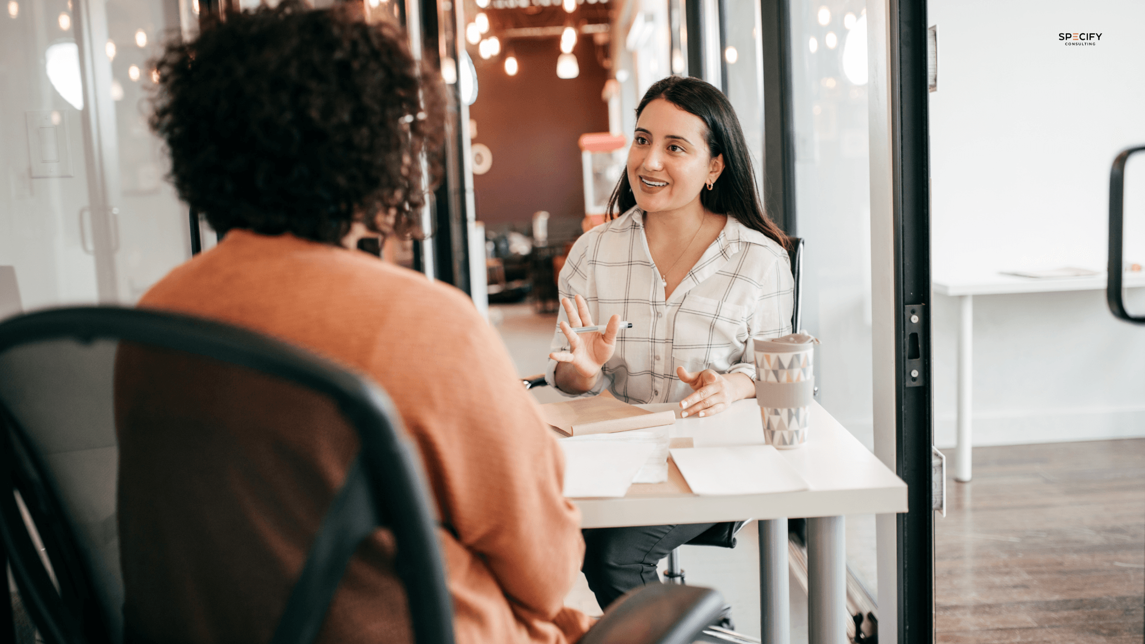 A professional in the commercial furniture industry reviewing a job offer, representing the reasons candidates decline offers and what furniture businesses can do to prevent it.