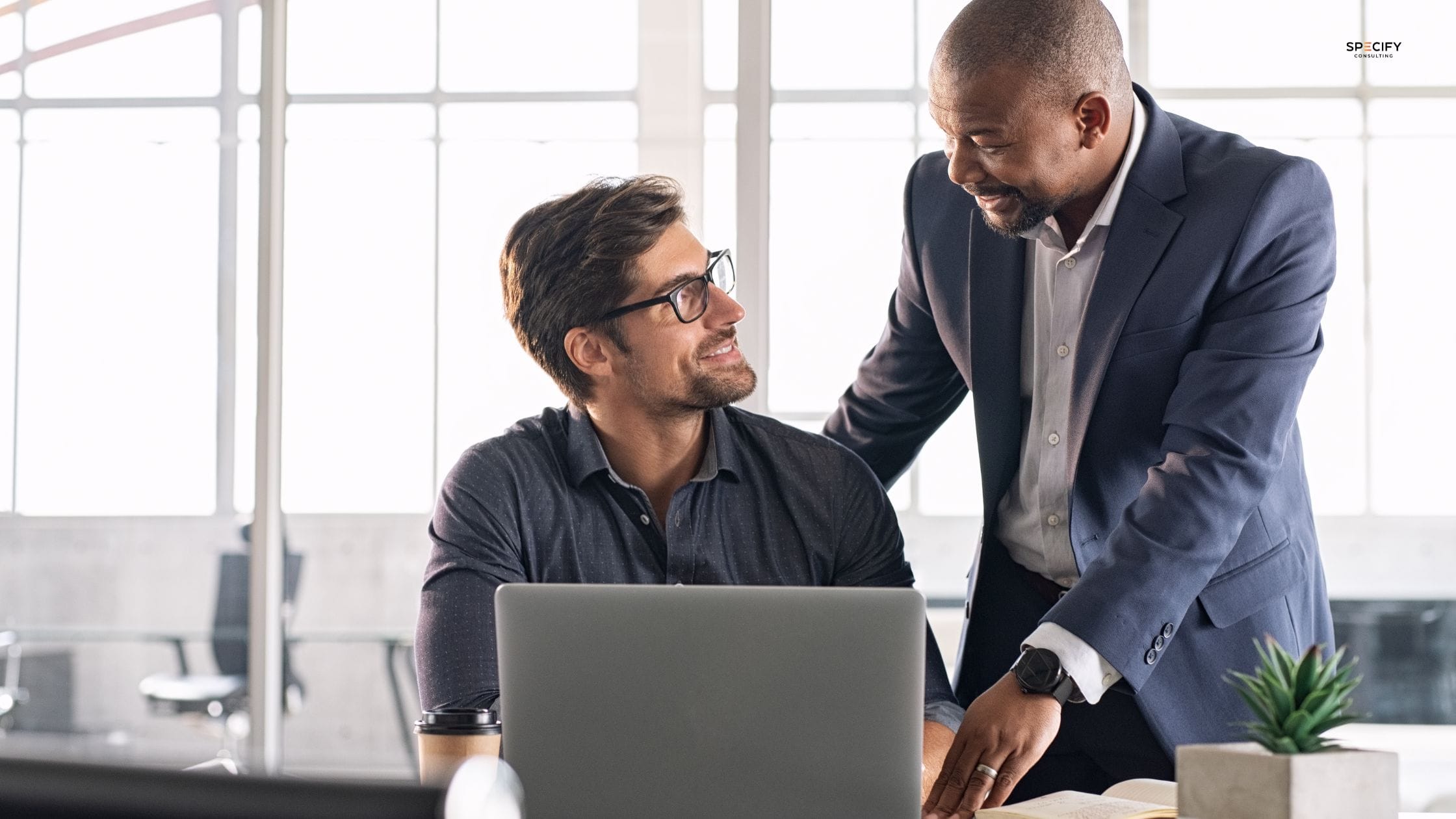 New sales professional being onboarded into a commercial lighting role in Australia, reviewing product ranges and lighting specifications in a showroom environment.